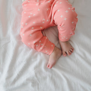 Baby legs wearing pink pants