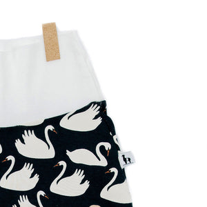 close-up of baby pants with swans print