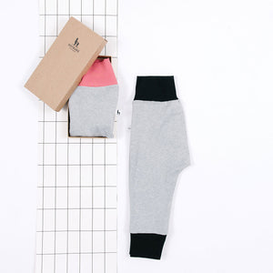 flat lay of classic grey baby pants gift set 