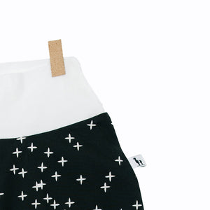 close-up of black baby pants with twinkle stars